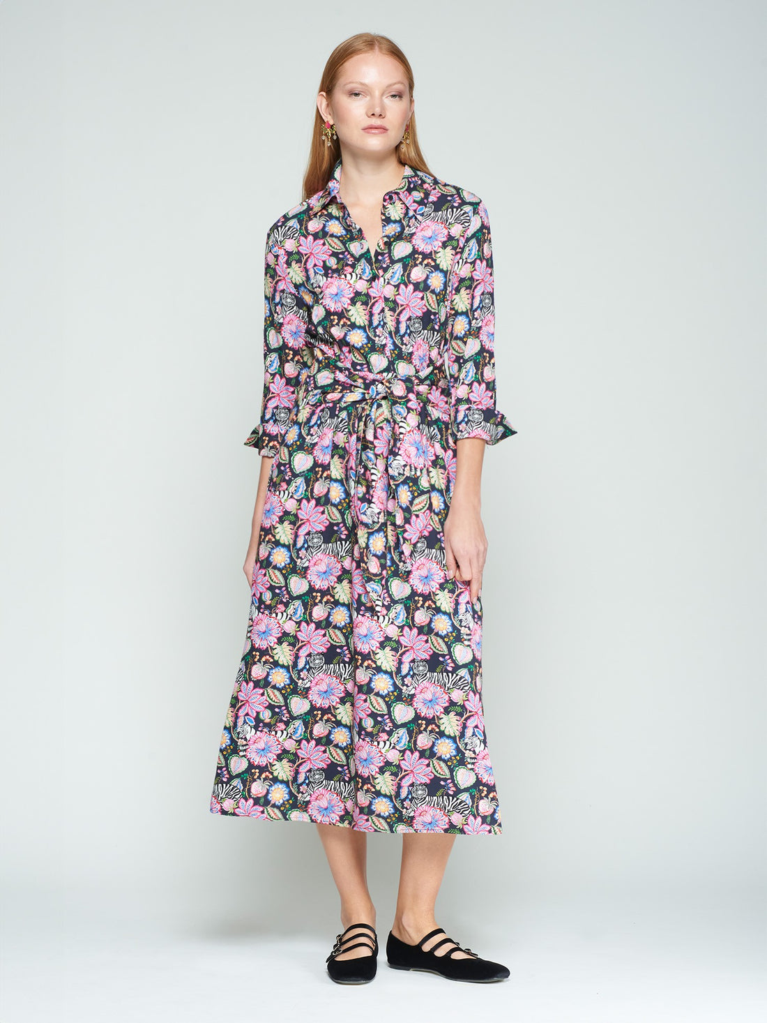 Woman wearing a floral dress on a white background
